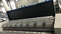 Machine de mesure à rouleaux pour peaux souples larges